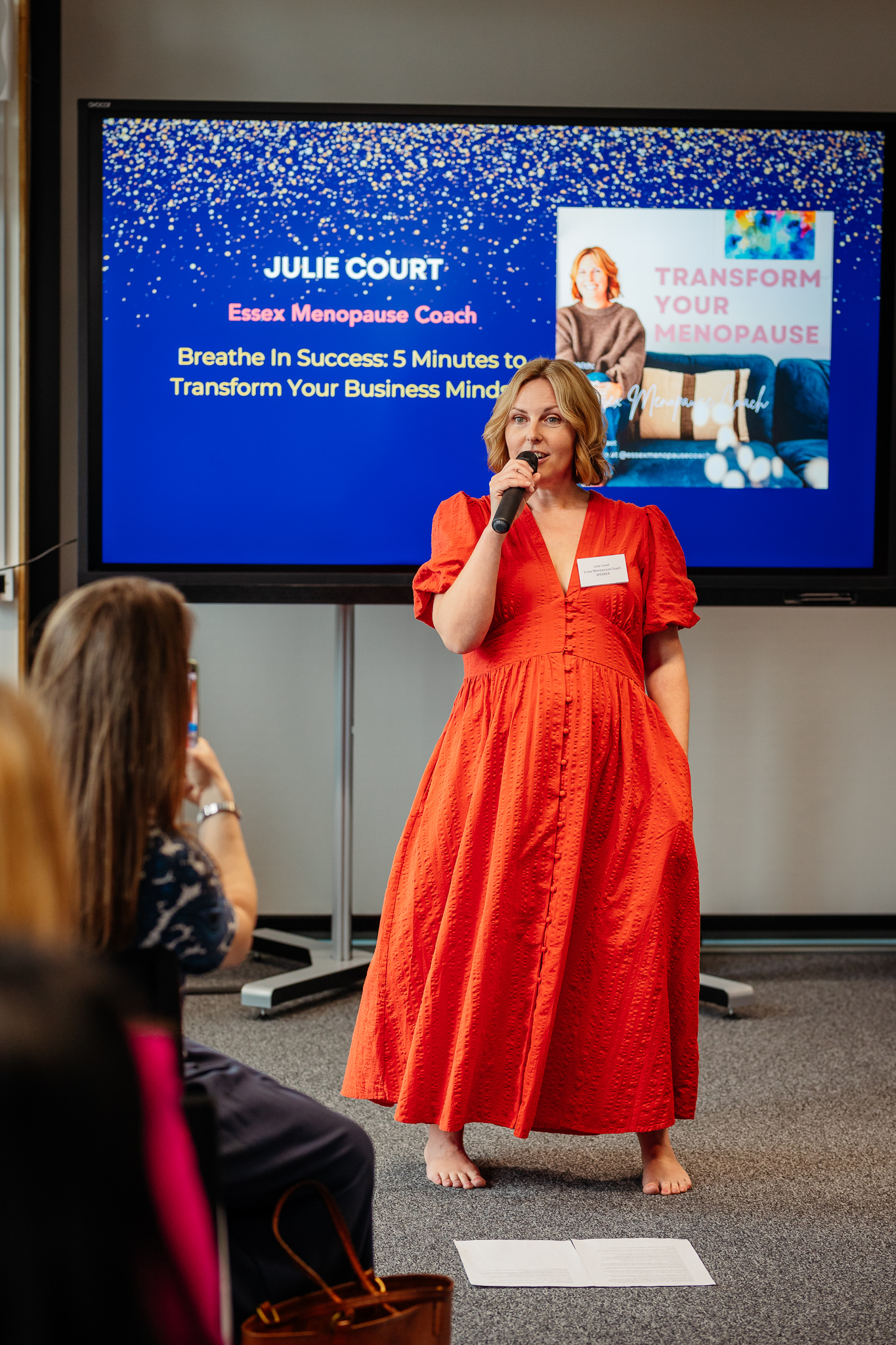 Julie, Essex Menopause Coach delivering a breathwork exercise at a menopause event 